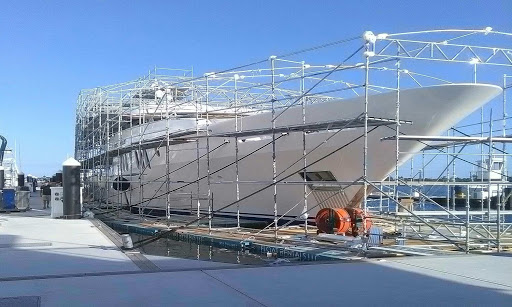 MAQ Brisbane boat builders work on large vessel with scaffolding