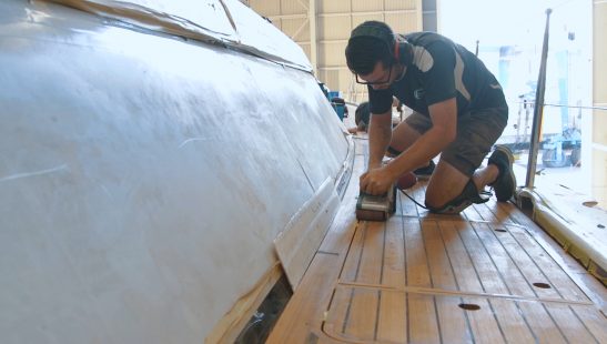 Brisbane boat builder sanding boat